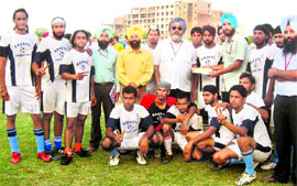 The winning football team of Baba Banda Singh Bahadur Polytechnic College, Fatehgarh Sahib, on Saturday.