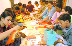 Students of Hamari Kaksha make Diwali gift items at Sector 7, Chandigarh, on Saturday.
