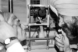 A doctor checks the eyes of a patient during a free eye check-up camp at Agarsain Hospital in Patiala on Saturday.