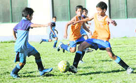 The match between Guru Nanak Academy and St Joseph Academy in progress during the final of the Council School Football Trophy in Dehradun on Saturday.