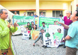 Members of the Citizens for Green Doon at the Divisional Forest Office in Dehradun on Saturday.