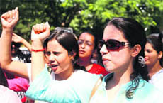 Striking doctors protest outside the GMCH in Jammu on Saturday.