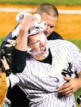 New York Yankees Mark Teixeira is hit in the face with a shaving cream pie by a teammate after hitting a walk off home run to defeat the Minnesota Twins in New York