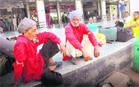 Two porters take a break after a hectic day at the Chandigarh railway station.