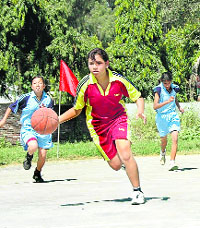 State-level women basketball tournament under way at Parade Ground in Dehradun on Sunday.