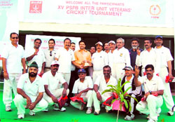 HPCA president Anurag Thakur with the winning team of the XV PSPB inter-unit veterans cricket tournament at Dharamsala on Sunday.