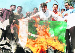 Members of the Jammu West Assembly Movement burn Pakistans national flag during a protest against frequent cross-border firing and infiltration bids, in Jammu on Sunday.