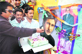 Surinder Kumar, a taxi driver and a fan of Amitabh Bachchan, celebrates his birthday in Jammu on Sunday