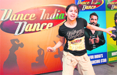 A girl performs during Dance India Dance auditions; and left