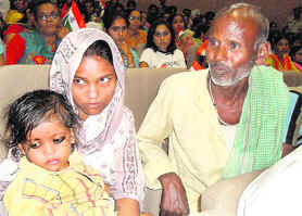 Parvati, wife of tea vendor Santosh, along with her son and father Jagdish Mandal.
