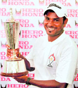 C Muniyappa with the trophy after winning the Hero Honda Indian Open in Gurgaon on Sunday.