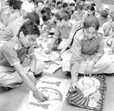 Students participate in a painting competition organised by the AP Jain Hospital at Rajpura on Monday.