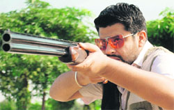 Khushbaz Singh Jattana aims a shot during the Punjab State Shooting Championship at Mohali on Monday. 