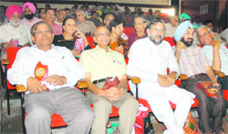 Retired teachers who were awarded during a function at Panjab University in Chandigarh on Monday. 