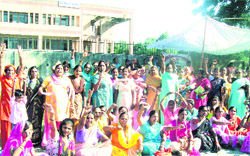 Anganwadi workers hold a protest at the Roshanabad headquarters in Haridwar on Monday.