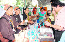 Visitors at a self-help group stall at Vaniki Mela held at Rangers College in Dehradun