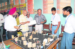  Judges view models at a science meet organised in MM PG College, Fatehabad. 