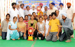 Winners at the youth fest with chief guest Balwinder Singh Bhunder at the National College Bhikhi in Mansa district on Tuesday.