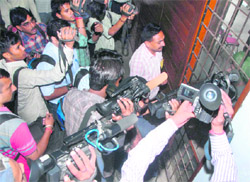 Photographers confined to a room adjoining the hall where Rahul Gandhis interactive session was going on at the PU