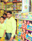 A customer selects items at a crackers shop in Dehradun on Tuesday. 