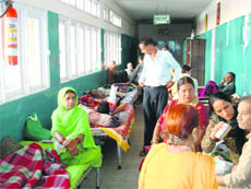  Patients lying in the corridors of the old building of the Palampur Civil Hospital.