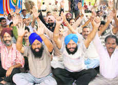 SRTC employees protest in Jammu on Tuesday.