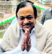 Home Minister P. Chidambaram greets party supporters at Congress party headquarters in Srinagar on Tuesday.