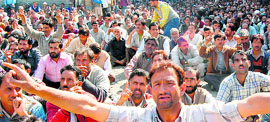 Protesting Jammu and Kashmir State Road Transport Corporation (SRTC) employees shout slogans against the state government in Srinagar.