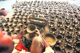 A potter works on diyas ahead of Diwali in Ludhiana.