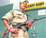 An ITBP personnel guards EVMs at a college in Gurgaon.
