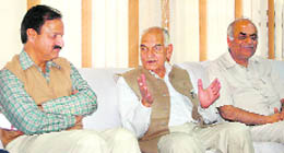 Education minister ID Dhiman (centre) addressing the media at Dharamsala on Wednesday.