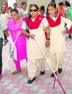 Visually challenged children try out their white canes donated by Amway Foundation on the International White Cane Day in Chandigarh on Thursday.