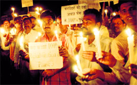 Members of the Chandigarh Industrial Area Tenants Association hold a candlelight procession in support of their long-pending demand of rehabilitation, in Chandigarh on Thursday.