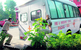 Firemen push an ambulance to start it at the Sector 17 fire station in Chandigarh on Thursday.
