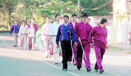 Visually impaired students of the National Institute of Visually Handicapped on a trek to Mussoorie from Dehradun on Thursday.