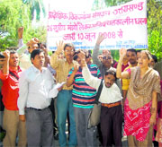 Members of the Uttarakhand State Disabled Organisation hold a protest in Dehradun on Thursday.