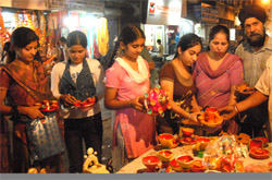 Residents purchase items for Divali in a Jalandhar market on Thursday. 