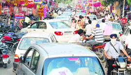 Vehicles choke one of the city roads on Thursday.