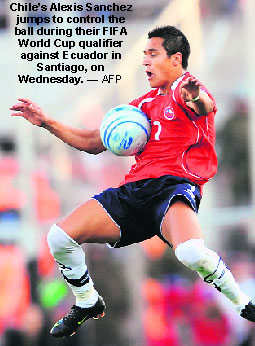 Chiles Alexis Sanchez jumps to control the ball during their FIFA World Cup qualifier against Ecuador in Santiago, on Wednesday.  AFP