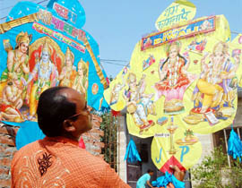 A kite maker makes kites with pictures of gods and godesses for Divali in Amritsar.