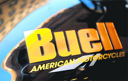 A Buell motorcycle is seen in front of a Harley-Davidson dealer in downtown Rome on Friday. Harley announced a big restructuring on Thursday, saying it was discontinuing its Buell motorcycle line and selling its MV Agusta unit, essentially exiting the sport bike market and returning to its heavyweight motorcycles. 