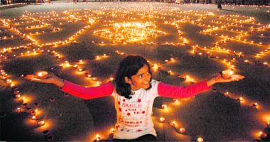 LIGHT AND HOPE ALL AROUND: A girl lights up diyas for peace and prosperity of City Beautiful as part of a programme organised by the Anti-Terrorist Front in Sector 17, Chandigarh