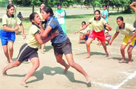 Players of Patiala (blue) and Kapurthala teams in action during the 55th Inter-State School Kabaddi Meet at Polo Grounds at Patiala