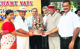 ONGC XI captain receives the trophy from Jot Singh Gunsola, Mussoorie legislator, in Dehradun on Friday.