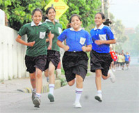 Students of Heritage School participate in the marathon race in Dehradun on Friday. 