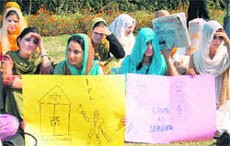 Junior doctors protest at the Government Medical College in Srinagar on Friday.