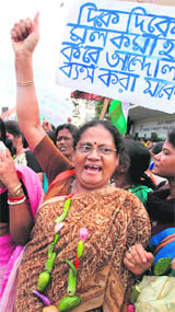 A woman protests against price hike at a rally in Kolkata on Friday.