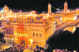 A view of the illuminated Golden Temple on Diwali eve in Amritsar