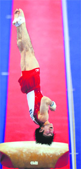 Kohei Uchimura of Japan competes on the vault in the individual all-around final of the Gymnastics World Championships in London