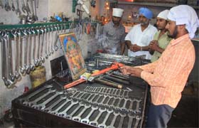 Workers worshipping their tools on Vishwakarma Day on Sunday in Bathinda
